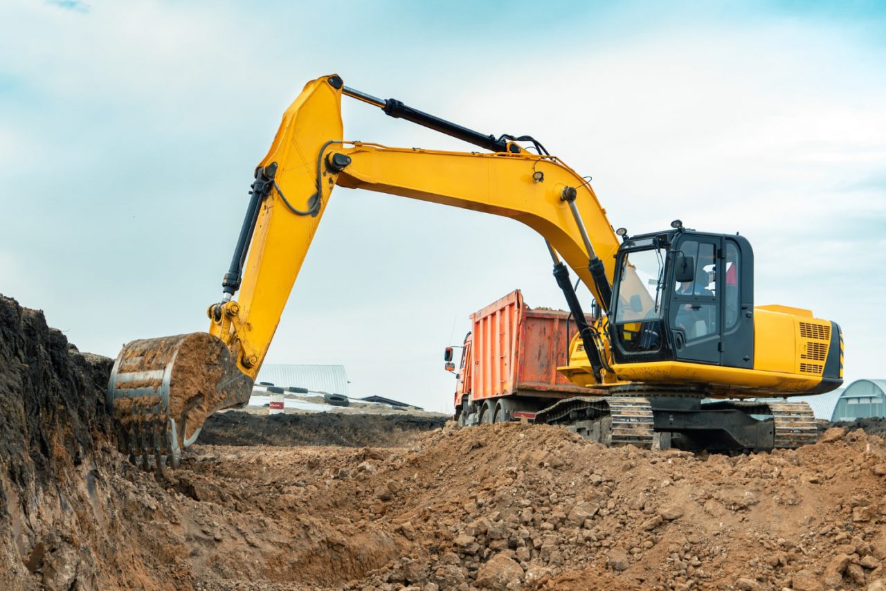 Excavator working on a construction site in daylight